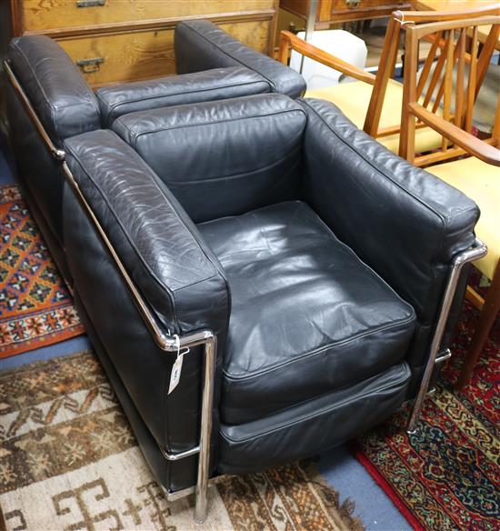 A pair of Le Corbusier style black leather and chrome chairs